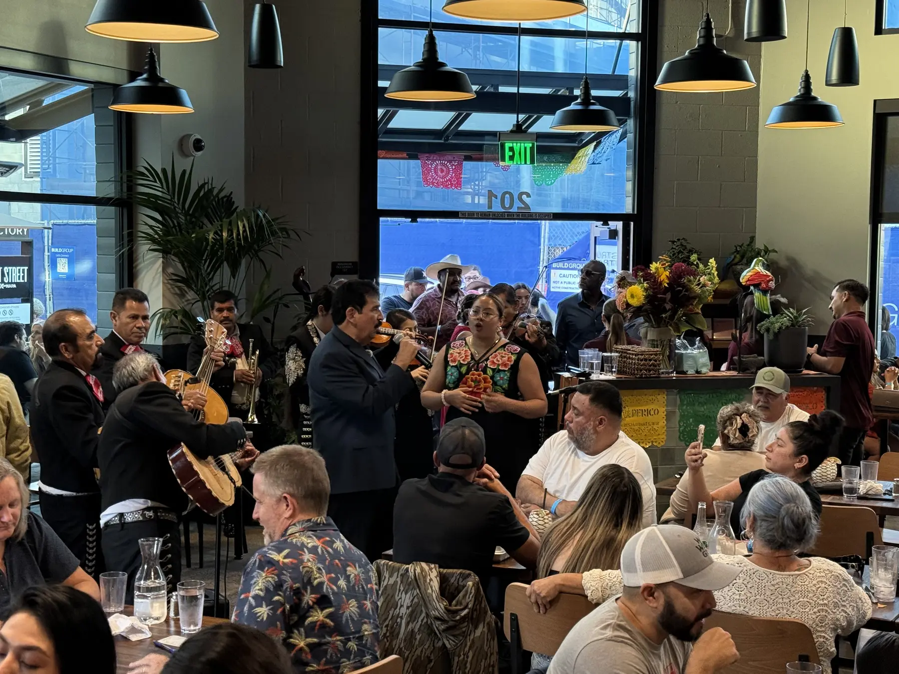 Mariachi musicians performing for guests during Don Perico’s grand opening