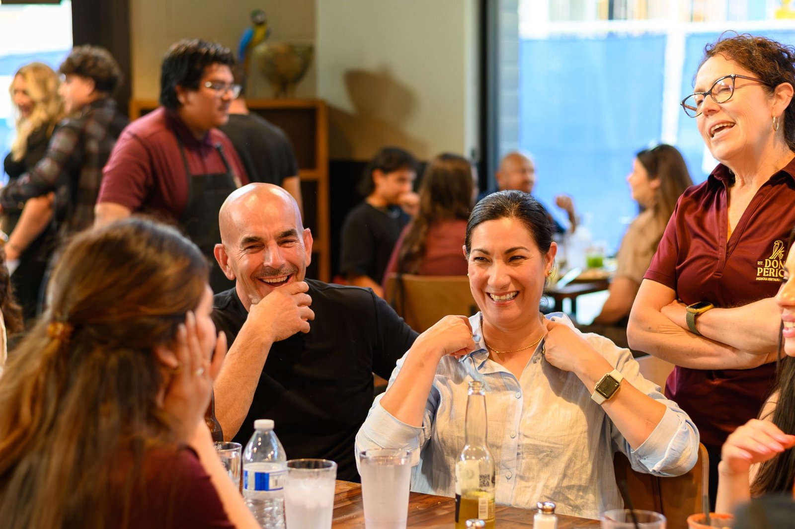 Guests laughing together at a Don Perico celebration