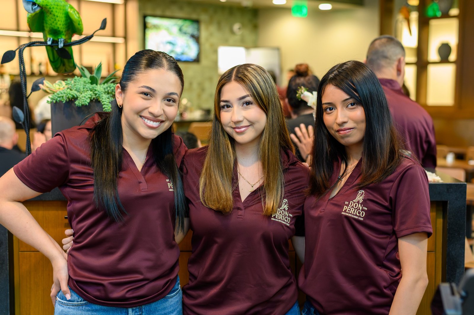 Three members of the Don Perico team welcoming guests